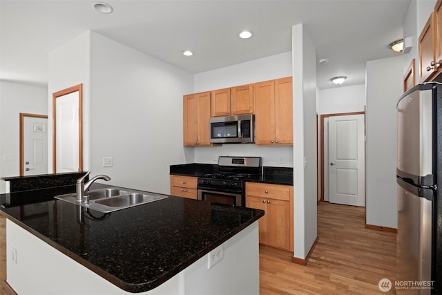6214 Malloy Ave, Ferndale, WA 98248 - kitchen with stainless steel appliances, light wood finished floors, recessed lighting, and dark stone countertops