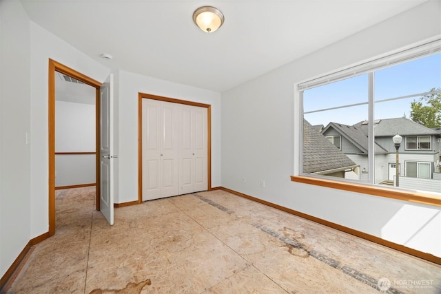 6214 Malloy Ave, Ferndale, WA 98248 - unfurnished bedroom featuring baseboards and a closet
