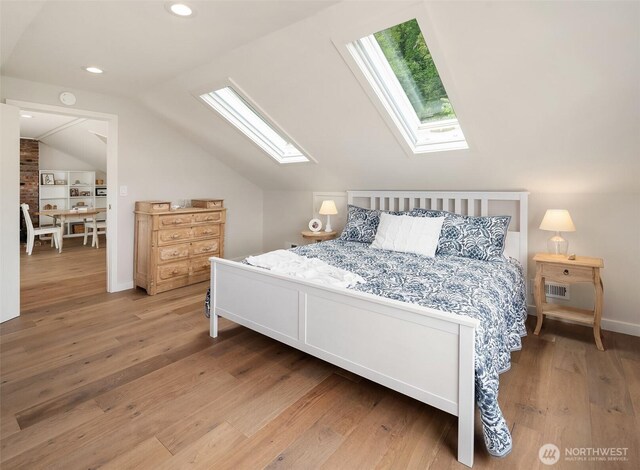 26321 Pillsbury Rd SW, Vashon, WA 98070 - bedroom featuring a skylight, wood finished floors, vaulted ceiling, and recessed lighting