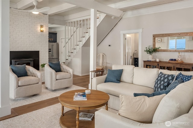 26321 Pillsbury Rd SW, Vashon, WA 98070 - living room with beamed ceiling, wood finished floors, stairway, ceiling fan, and a fireplace