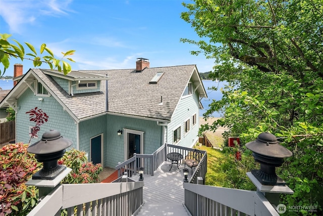 26321 Pillsbury Rd SW, Vashon, WA 98070 - rear view of property featuring a shingled roof, a chimney, and a wooden deck
