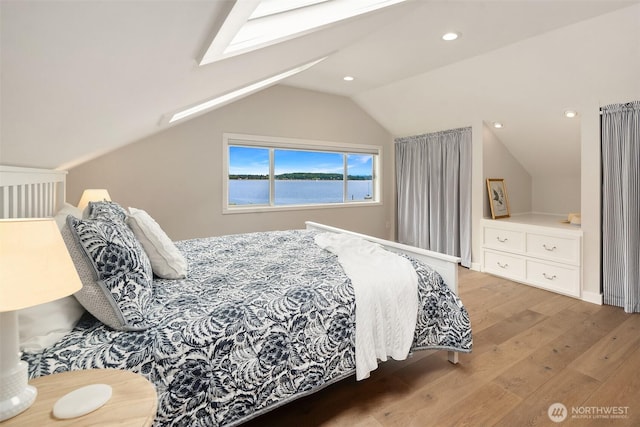 26321 Pillsbury Rd SW, Vashon, WA 98070 - bedroom with vaulted ceiling, wood finished floors, a skylight, and recessed lighting