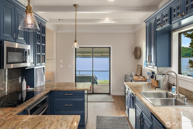 26321 Pillsbury Rd SW, Vashon, WA 98070 - kitchen with blue cabinets, light wood-style floors, a peninsula, black electric cooktop, and beamed ceiling
