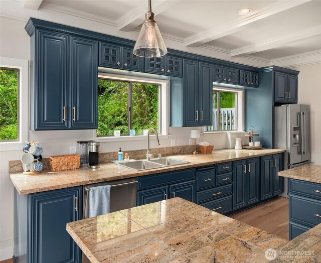 26321 Pillsbury Rd SW, Vashon, WA 98070 - kitchen featuring blue cabinetry, crown molding, stainless steel appliances, light wood-style flooring, and pendant lighting