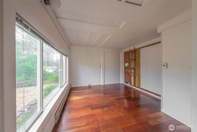 5507 N 45th St, Tacoma, WA 98407 - unfurnished sunroom with plenty of natural light and a baseboard radiator