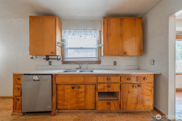 5507 N 45th St, Tacoma, WA 98407 - kitchen featuring dishwasher, light wood-type flooring, and light countertops