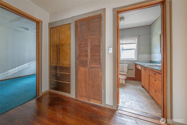 5507 N 45th St, Tacoma, WA 98407 - bathroom with a closet, vanity, and hardwood / wood-style floors