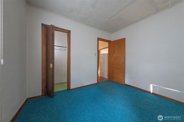 5507 N 45th St, Tacoma, WA 98407 - unfurnished bedroom with carpet floors and a textured ceiling