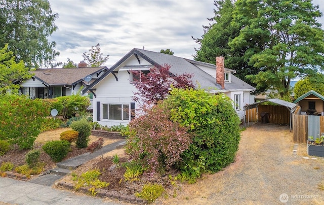 5507 N 45th St, Tacoma, WA 98407 - view of front facade with a detached carport and a chimney
