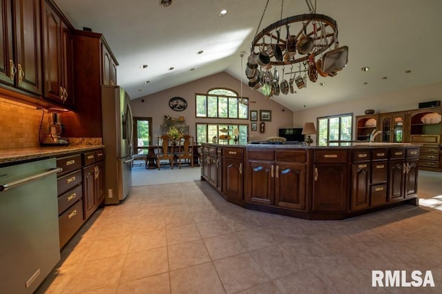 kitchen with light tile floors, plenty of natural light, and stainless steel appliances