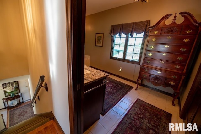 bathroom featuring tile floors and vanity