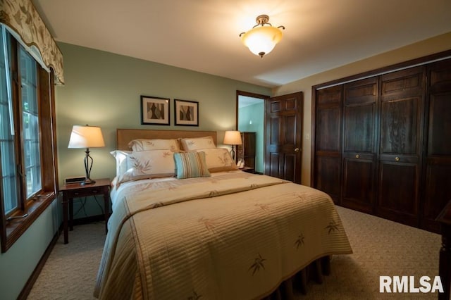 carpeted bedroom featuring a closet