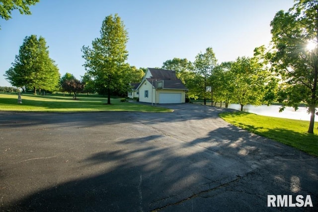 view of front facade with a front lawn and a garage