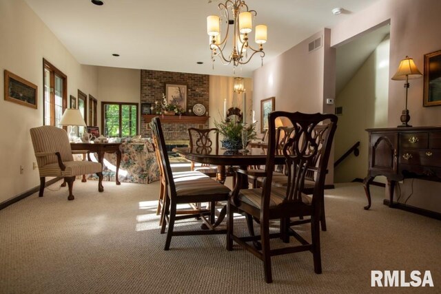 carpeted dining area with an inviting chandelier