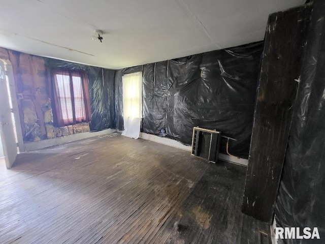 empty room with dark hardwood / wood-style floors