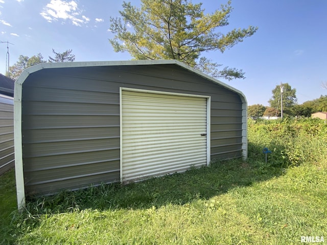 garage with a yard