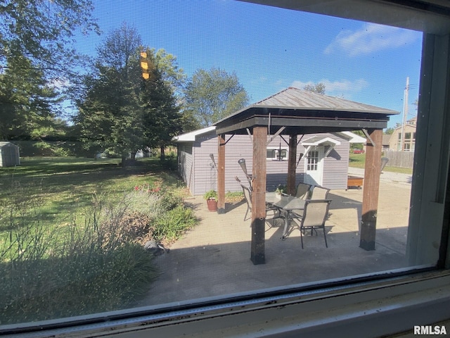 view of patio / terrace with a gazebo and an outdoor structure