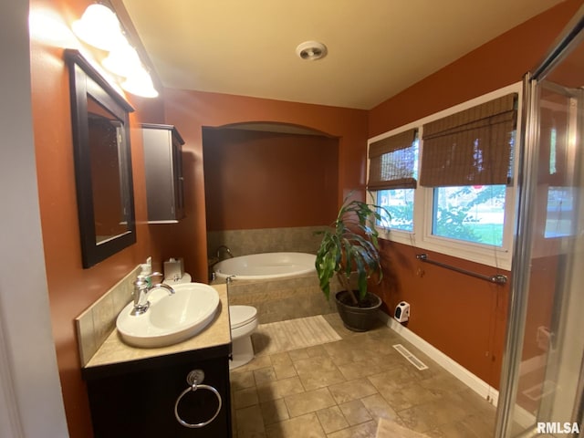 full bathroom with toilet, vanity, and plus walk in shower