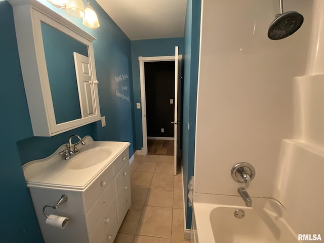 bathroom featuring tile patterned floors, vanity, and shower / washtub combination