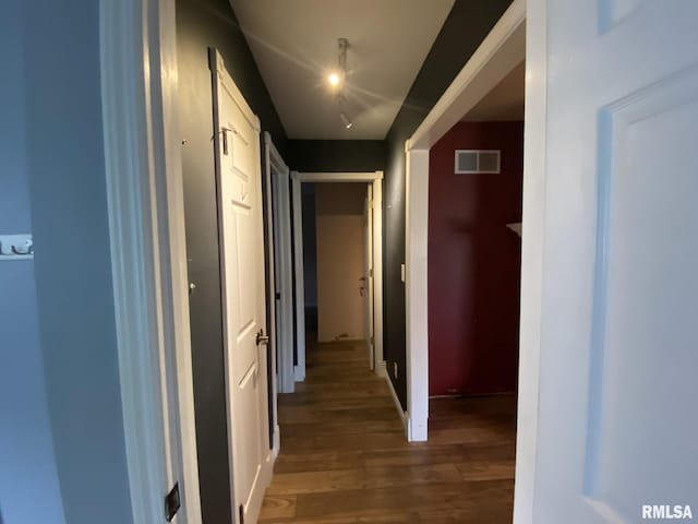 hallway featuring dark hardwood / wood-style floors