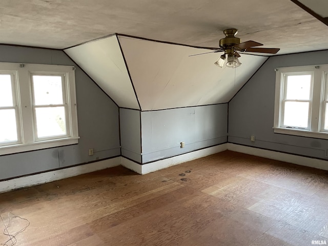 bonus room with ceiling fan and lofted ceiling