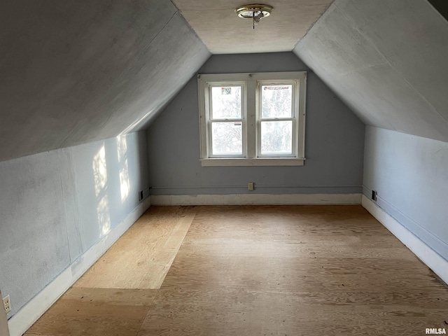 bonus room with vaulted ceiling