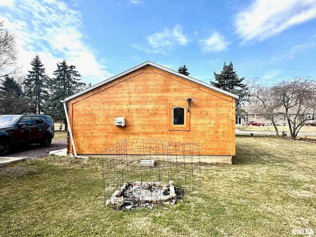 view of side of home with a lawn