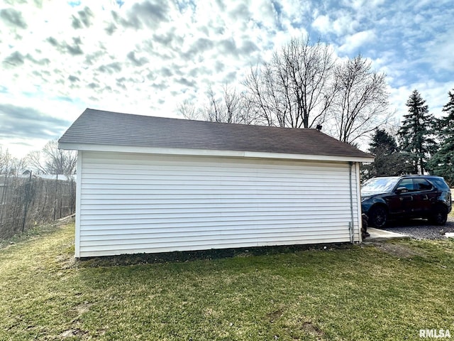 garage featuring a yard