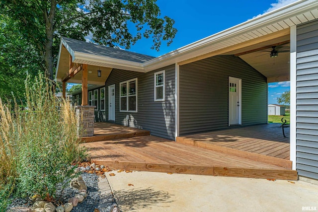 exterior space featuring a wooden deck and ceiling fan