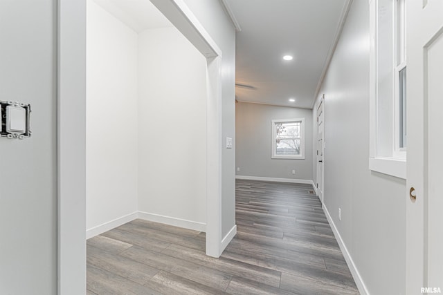 hallway with hardwood / wood-style flooring