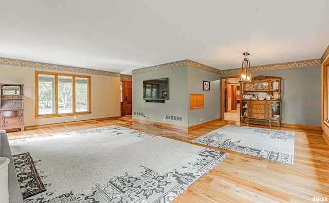 unfurnished living room featuring hardwood / wood-style floors