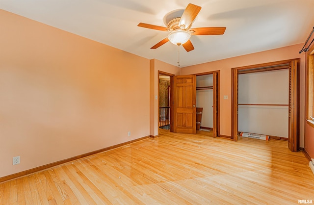 unfurnished bedroom with ceiling fan and light hardwood / wood-style floors