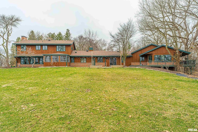 back of house featuring a yard