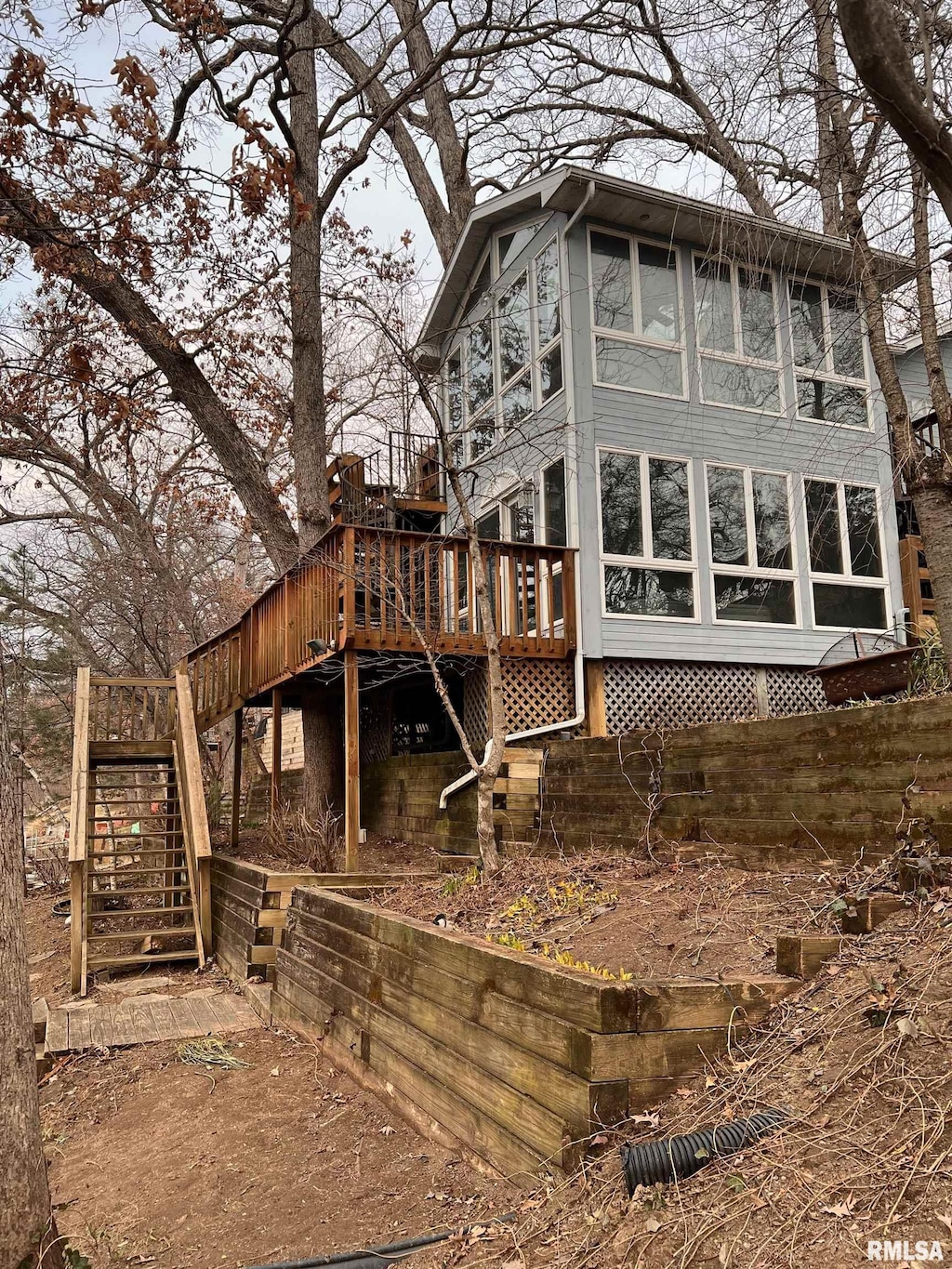 view of side of property with a deck