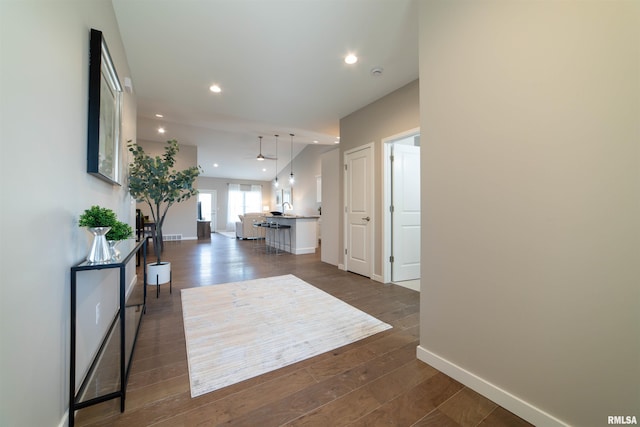 hallway featuring dark hardwood / wood-style floors