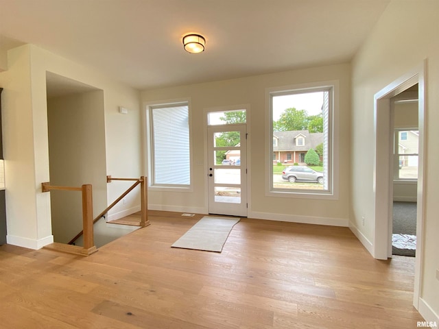 doorway to outside featuring light wood-type flooring