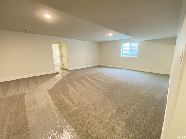 carpeted empty room with recessed lighting and baseboards