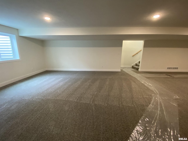 basement with baseboards, visible vents, stairway, carpet floors, and recessed lighting