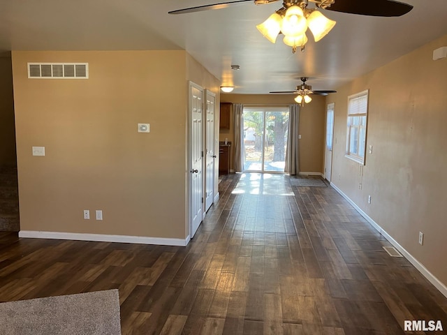 interior space featuring ceiling fan and dark hardwood / wood-style flooring