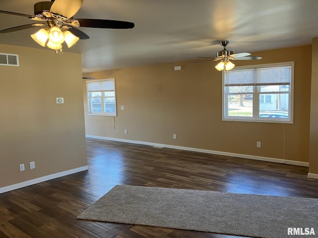 unfurnished room featuring ceiling fan and dark wood-type flooring