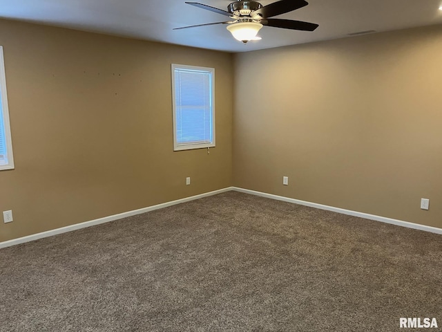 carpeted spare room with ceiling fan