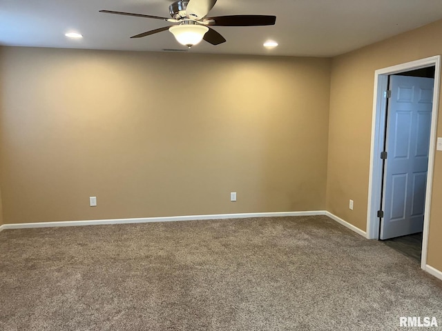 carpeted empty room featuring ceiling fan