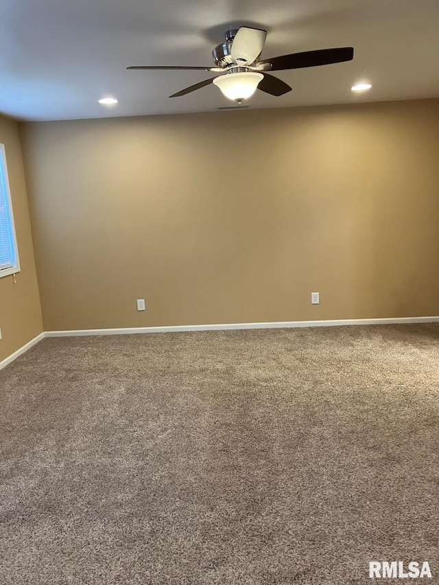 empty room featuring ceiling fan and carpet flooring