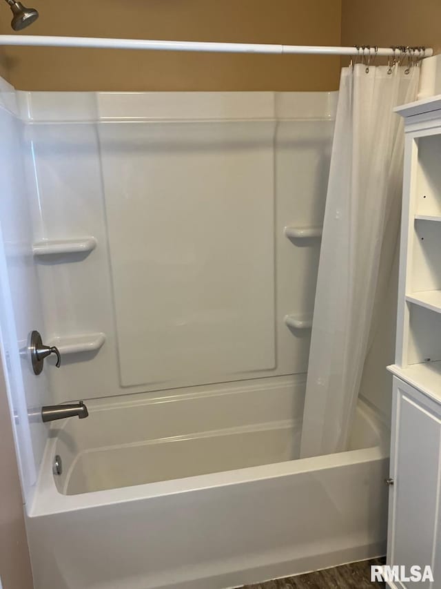 bathroom featuring shower / bathtub combination with curtain