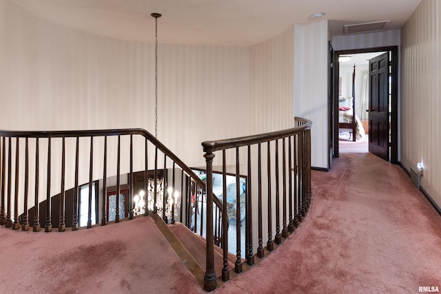 stairway with dark colored carpet