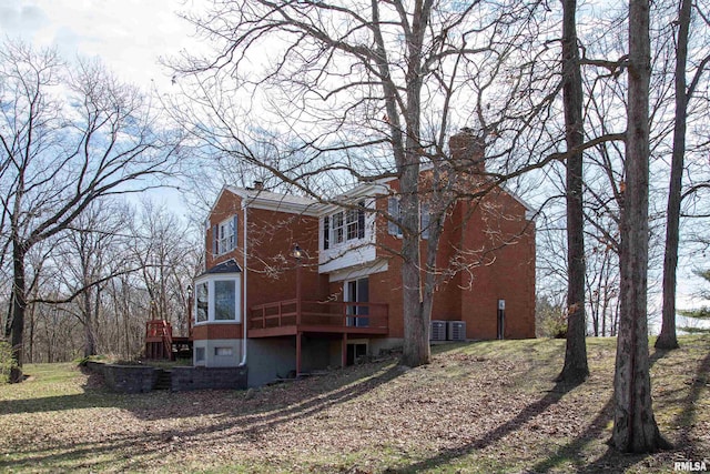 view of home's exterior with a deck