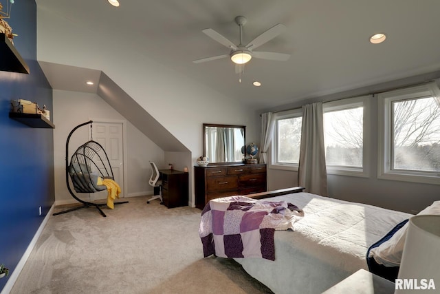 bedroom featuring light carpet, vaulted ceiling, and ceiling fan