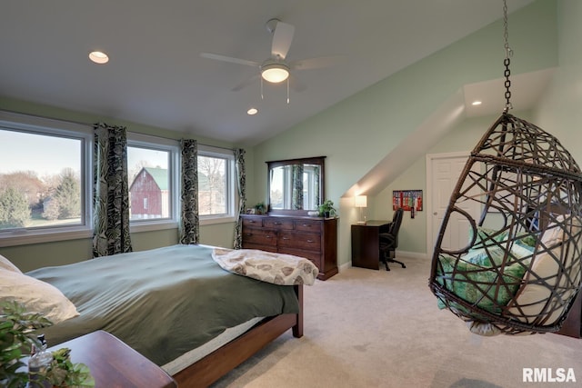 bedroom featuring lofted ceiling, ceiling fan, and light colored carpet