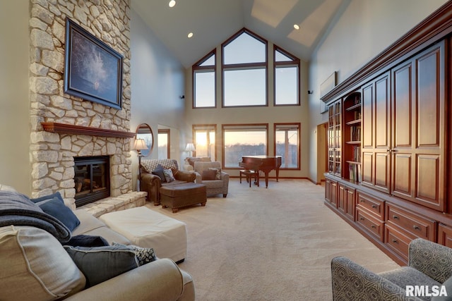 living room with light carpet, high vaulted ceiling, and a fireplace