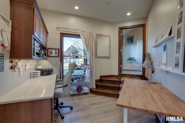 office with light hardwood / wood-style flooring